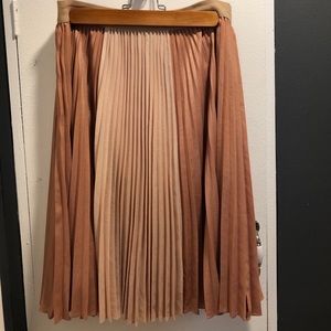 Pleated mid-length rose/tan BCBG skirt.